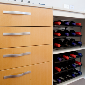 Vinrac wine racks inside of a kitchen cupboard.