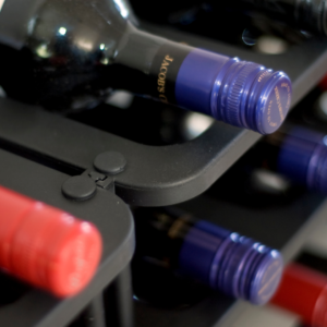 Close-up shot of wine bottles on a Vinrac wine rack.