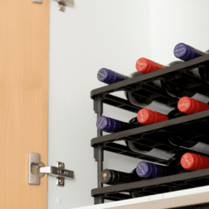 Vinrac wine racks inside of a kitchen cupboard.