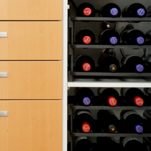 Vinrac wine racks inside of a kitchen cupboard.
